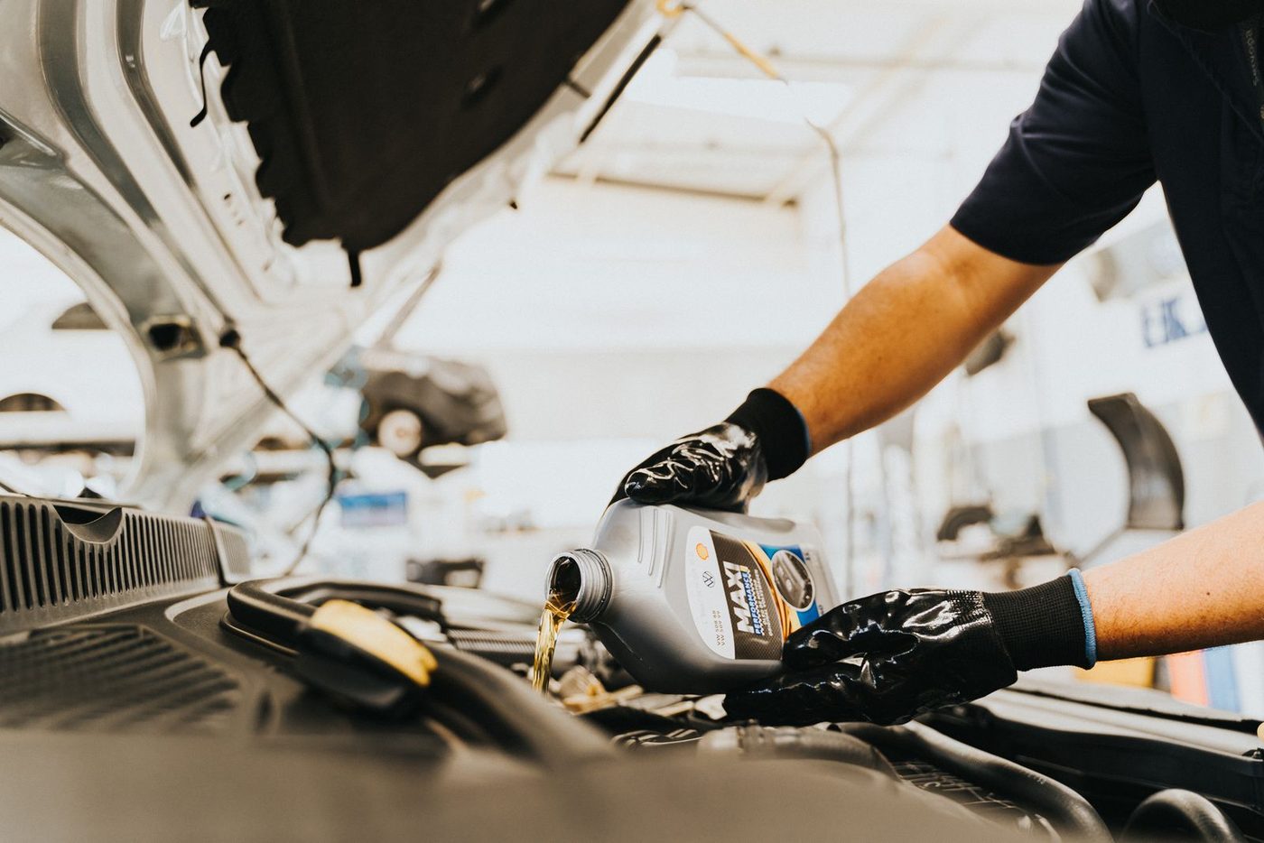 Fresh oil being poured into an engine