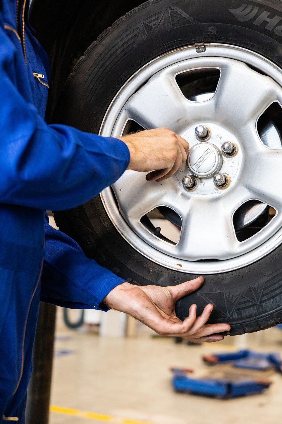 A wheel being fitted back onto the hub during a rotation
